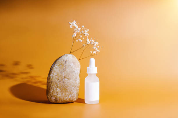 istock Natural organic spa cosmetics.Front view layout.Face and body treatment.Bio science beauty concept.bottle for branding and label.Cosmetic serum bottle on stone podium.Mockup cosmetics.Natural organic cosmetic skincare packaging mock up with leaves. 1441011059