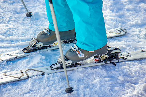 Ski boots on the white snow