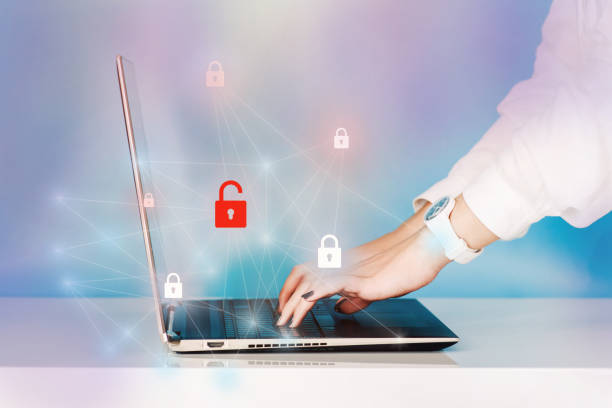 istock Cyber security and data protection.Business, technology, internet and networking concept. Young Business woman working on his laptop in the office, select the icon security on the virtual display. 1441012972