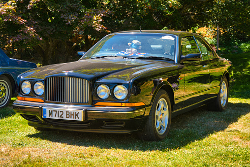 Baden-Baden, Germany - 10 July 2022: black Bentley Continental T 1991 is parked in Kurpark in Baden-Baden at the exhibition of old cars \