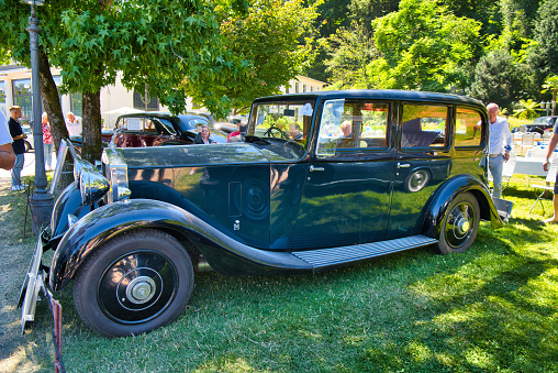 Baden-Baden, Germany - 10 July 2022: black ROLLS-ROYCE Silver Wraith HP 20-25 Park Ward Six Saloon construction 1934 is parked in Kurpark in Baden-Baden at the exhibition of old cars \