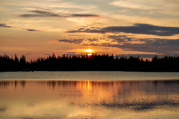 istock Sunrise at an alpine lake 1441014187