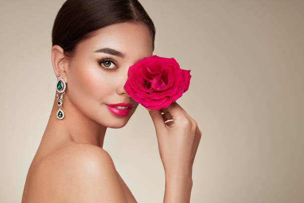 istock Beautiful young woman a rose flower 1441014622