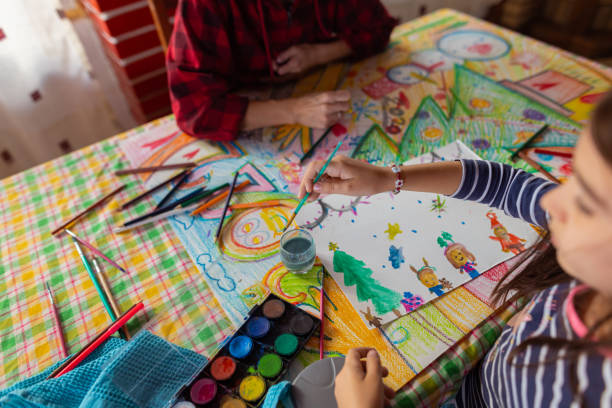 istock Creative family, making Christmas art and craft 1441015332