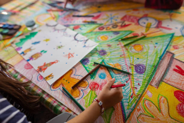 istock Family drawing and making a poster with a Christmas theme 1441015368