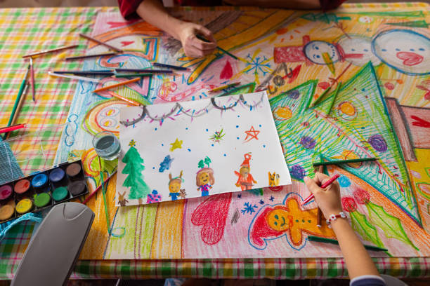 istock Family drawing and making a poster with a Christmas theme 1441015404