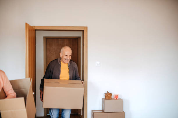 Multi-generation family moving in new apartment stock photo