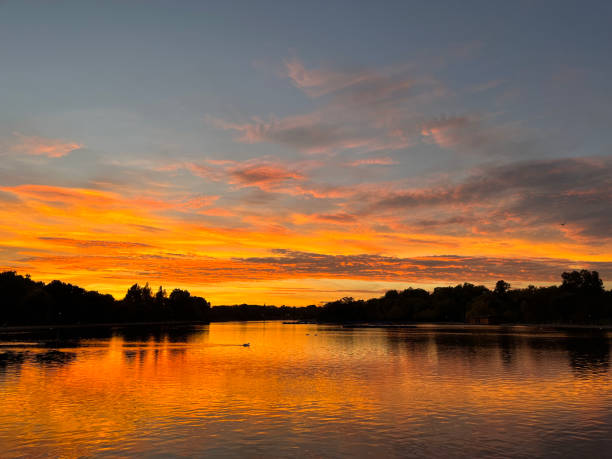 istock Sunset at the lake with beautiful orange sky 1441015740