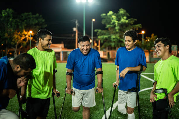istock Amputee soccer players talking on soccer field 1441016400