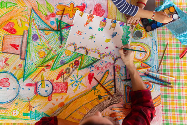 istock Creative girl and mother making a Christmas art 1441016508