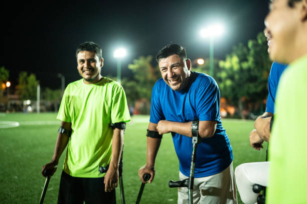 istock Amputee soccer players talking on soccer field 1441016597