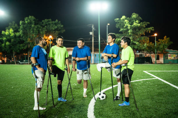 istock Amputee soccer players talking on soccer field 1441016598