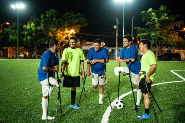 istock Amputee soccer players talking on soccer field 1441016607