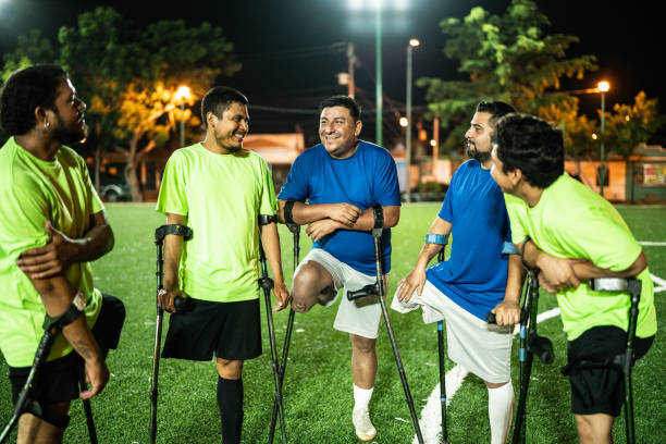istock Amputee soccer players talking on soccer field 1441016608