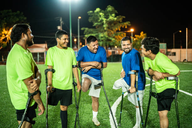 istock Amputee soccer players talking on soccer field 1441016615