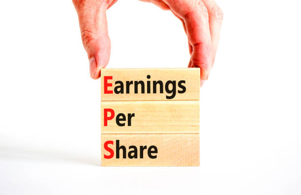 istock EPS earnings per share symbol. Concept words EPS earnings per share on wooden blocks on a beautiful white background. Businessman hand. Business and EPS earnings per share concept. Copy space. 1441016647