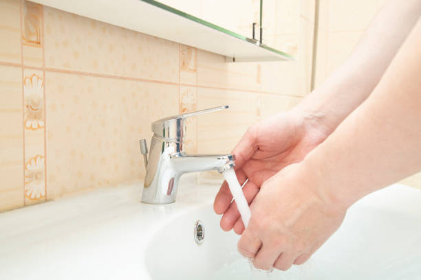 istock A man washes his hands with soap in the bathroom. 1441017296