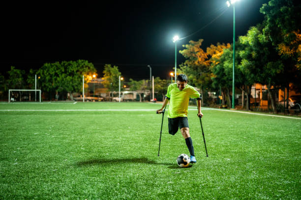 istock Young amputee player in a match on the soccer field 1441017760