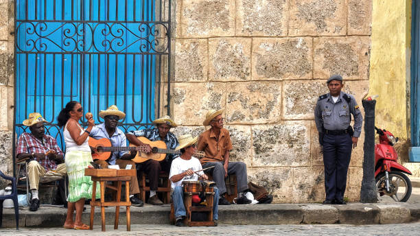 Havana, Cuba - February 2, 2010:  Street musicians play music for tourists in Havana.  Tourism is now Cubas main source of income and Cuban's depend on tourists to make ends meet.