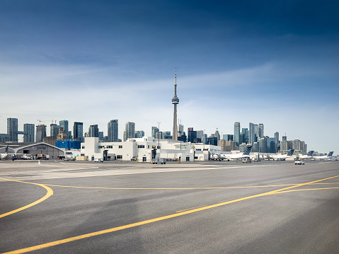 The Toronto waterfront  in the summer with the CN Tower in the background.