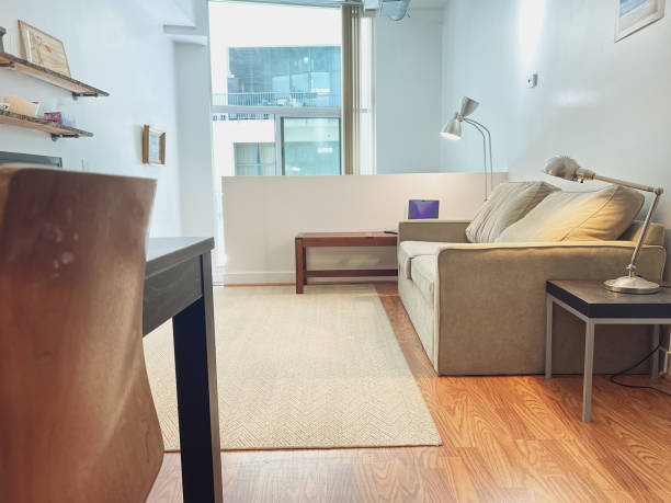 istock Sofa and illuminated lamps in modern apartment 1441025524