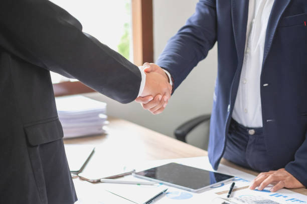 istock two business men shake hands for business cooperation 1441025887