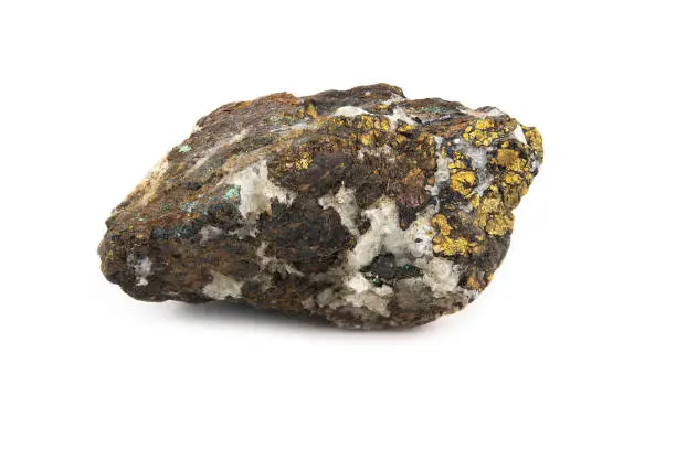 A piece of the mineral chalcopyrite with a rough surface and white and yellow inclusions. Isolated on white background.