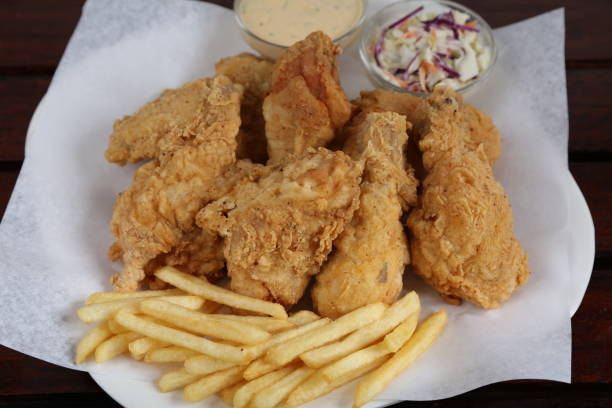 istock Regular Fried Chicken with fries, mayo dip and salad served in a dish isolated on table side view of middle east food 1441027171