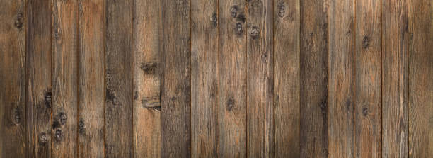 la trama del legno è naturale, la superficie di sfondo della trama delle tavole con un vecchio motivo naturale, la trama del legno con una bella venatura del legno, legno di noce o quercia, lo sfondo di tavole di legno - knotted wood plank wall abstract texture foto e immagini stock