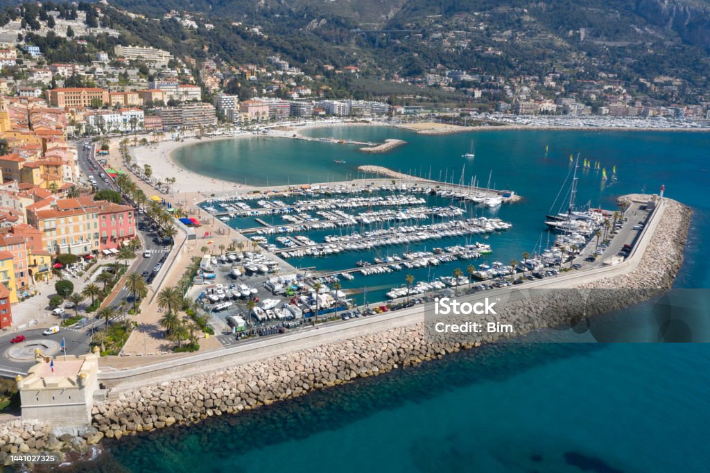 Yachts and Boats at Harbor in Menton, Aerial View, Cote d'Azur, French Riviera Rows of yachts in marina of Menton, old town is seen in the background, aerial view, Cote d'Azur, French Riviera, France, Europe. Aerial View Stock Photo