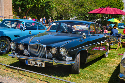 Baden-Baden, Germany - 10 July 2022: black Jaguar Mark X MK10 1961 is parked in Kurpark in Baden-Baden at the exhibition of old cars 