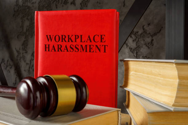 istock Workplace harassment law and gavel on the books. 1441031896