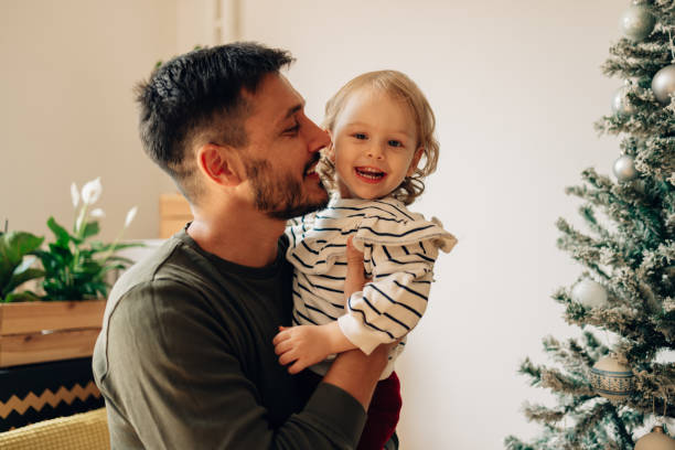 istock Happy Father Holding His Cute Daughter At Home 1441038067