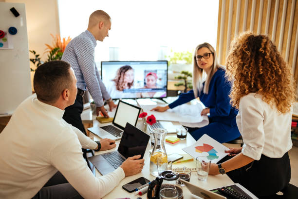 istock Yes, we all can do it. Young team working in the office 1441041553