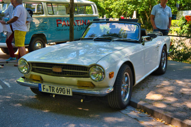– December 04, 2021: Classic historic red car in the street. Triumph GT6