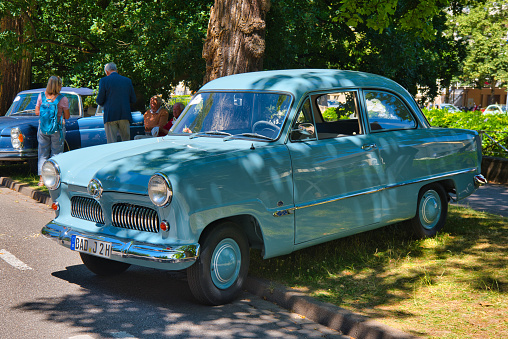 Baden-Baden, Germany - 10 July 2022: blue Ford Taunus P1 12M 1950 is parked in Kurpark in Baden-Baden at the exhibition of old cars 