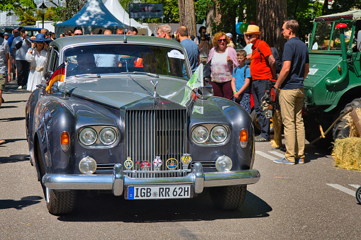 Baden-Baden, Germany - 10 July 2022: blue ROLLS-ROYCE SILVER SHADOW sedan limousine 1965 1980 is parked in Kurpark in Baden-Baden at the exhibition of old cars \
