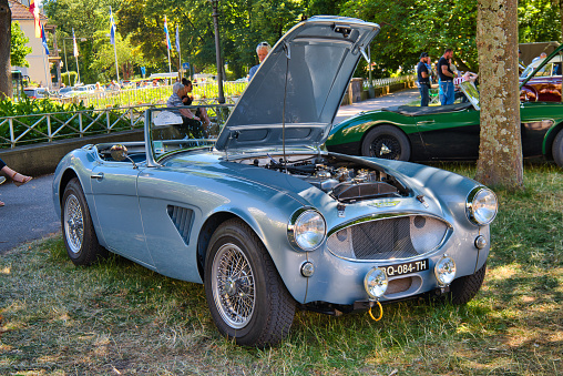 Baden-Baden, Germany - 10 July 2022: silver Austin Healey 3000 MK III 3 MK3 1963 cabrio roadster is parked in Kurpark in Baden-Baden at the exhibition of old cars \