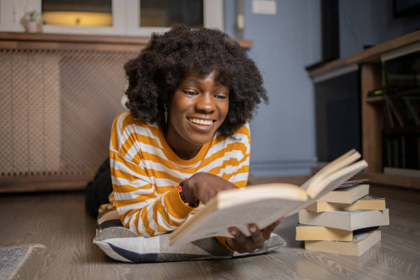 istock Woman relaxing and reading a book 1441059687