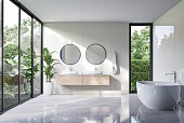 Modern luxury white bathroom with tropical style garden view 3d render