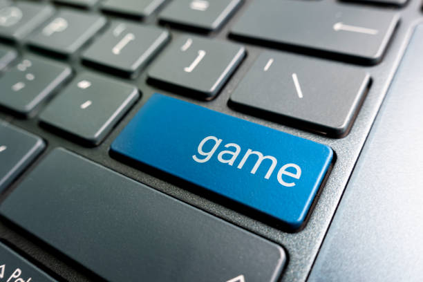 istock online games concepts, with message on enter key of computer keyboard. 1441067561