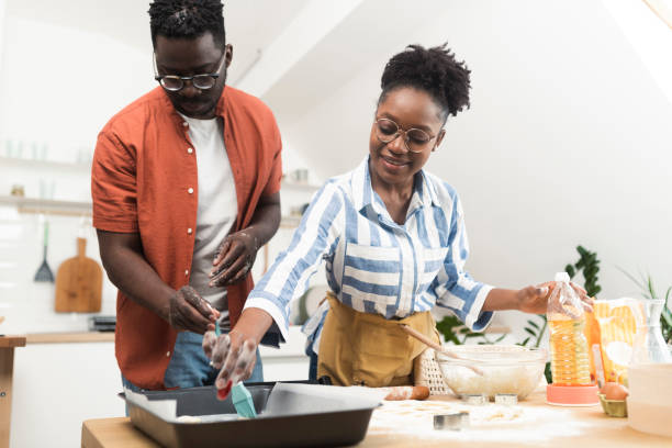 istock African American couple making handmade cookies 1441067693