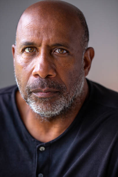istock Portrait of a mature aging older man looking not smiling. 1441069004