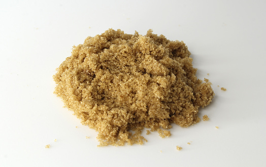 Brown sugar on a white background