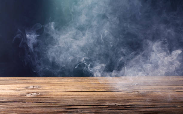 istock An old brown wooden floor or an empty table with white mist or smoke. on a black background 1441071505