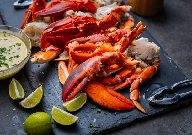 istock Lobster claws and Dungeness crab legs ready to eat 1441072944