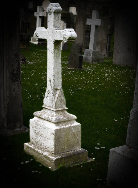 istock Graveyard with old white cross tombstones. 1441073306