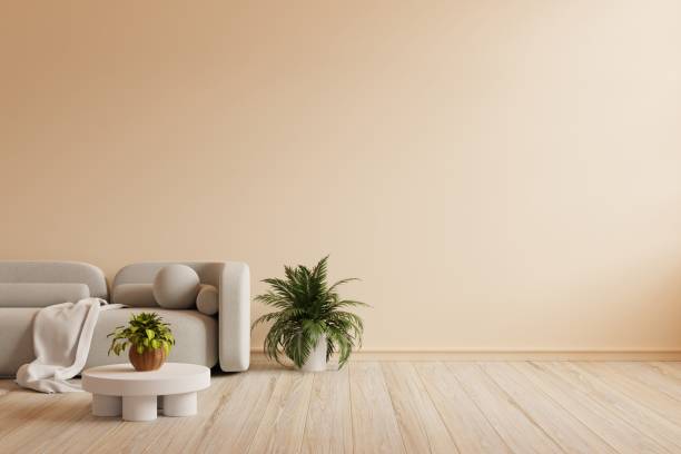 istock Japandi style interior with gray sofa and boho decor on cream color wall. 1441074019
