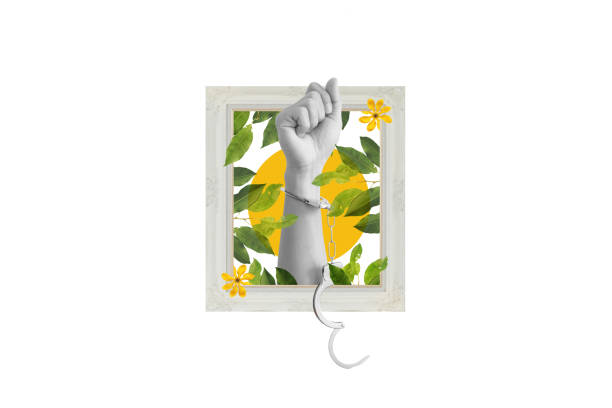 istock Digital collage modern art. Hand raised with handcuff and leaves, flowers in frame 1441075633