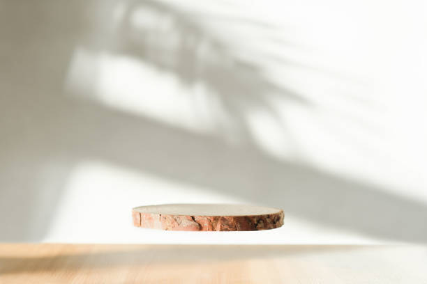 istock Levitating flying podium with shadows on background. Abstract podium for organic cosmetic products. Natural stand display for product presentation and sale 1441083034